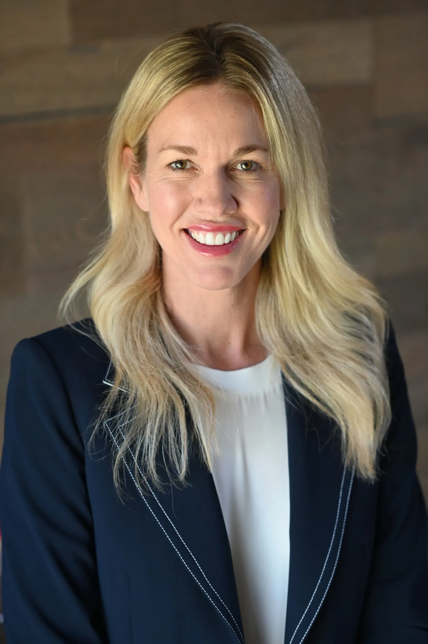 A photograph of a person wearing a suit.