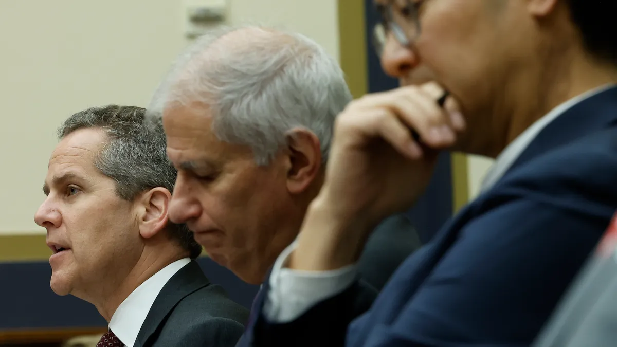 Michael Barr, the Federal Reserve's vice chair for supervision, speaks during a congressional hearing, while sitting next to Martin Gruenberg, chair of the FDIC and Michael Hsu, acting comptroller of the currency