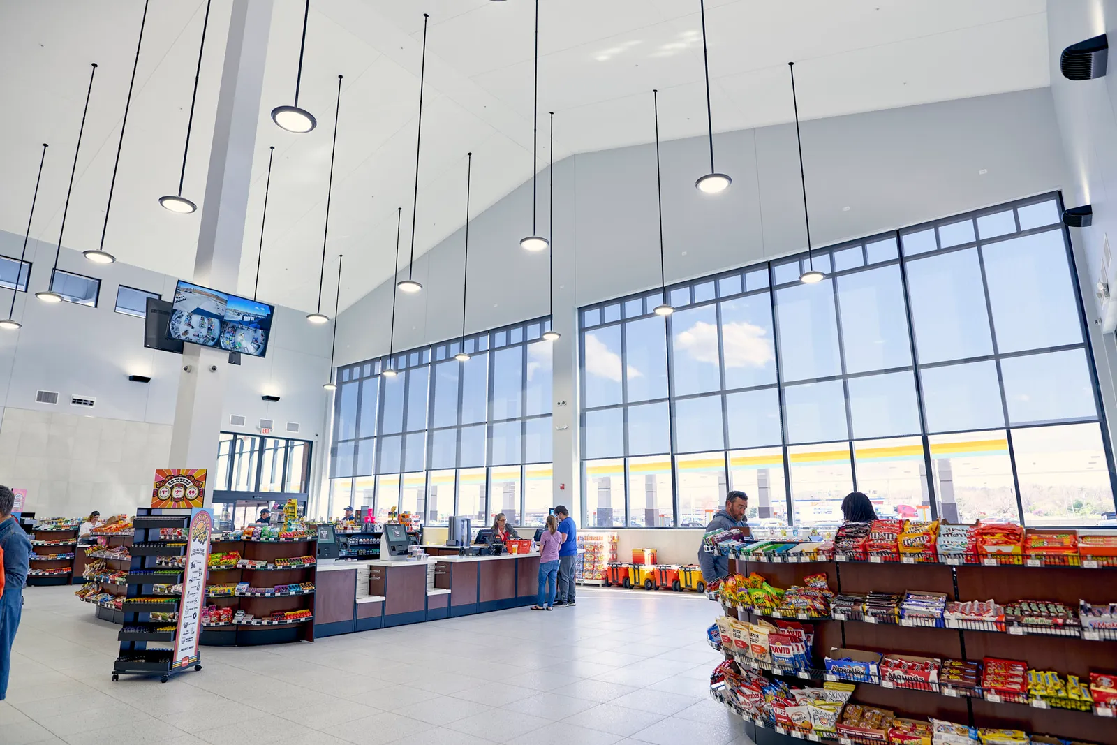 A photo of the interior of a store, showing the checkout areas and candy displays.