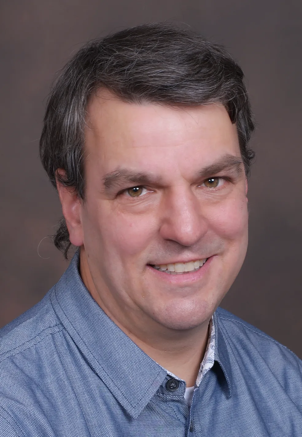 A head shot shows attorney Kenneth Krayeske in business casual clothing.