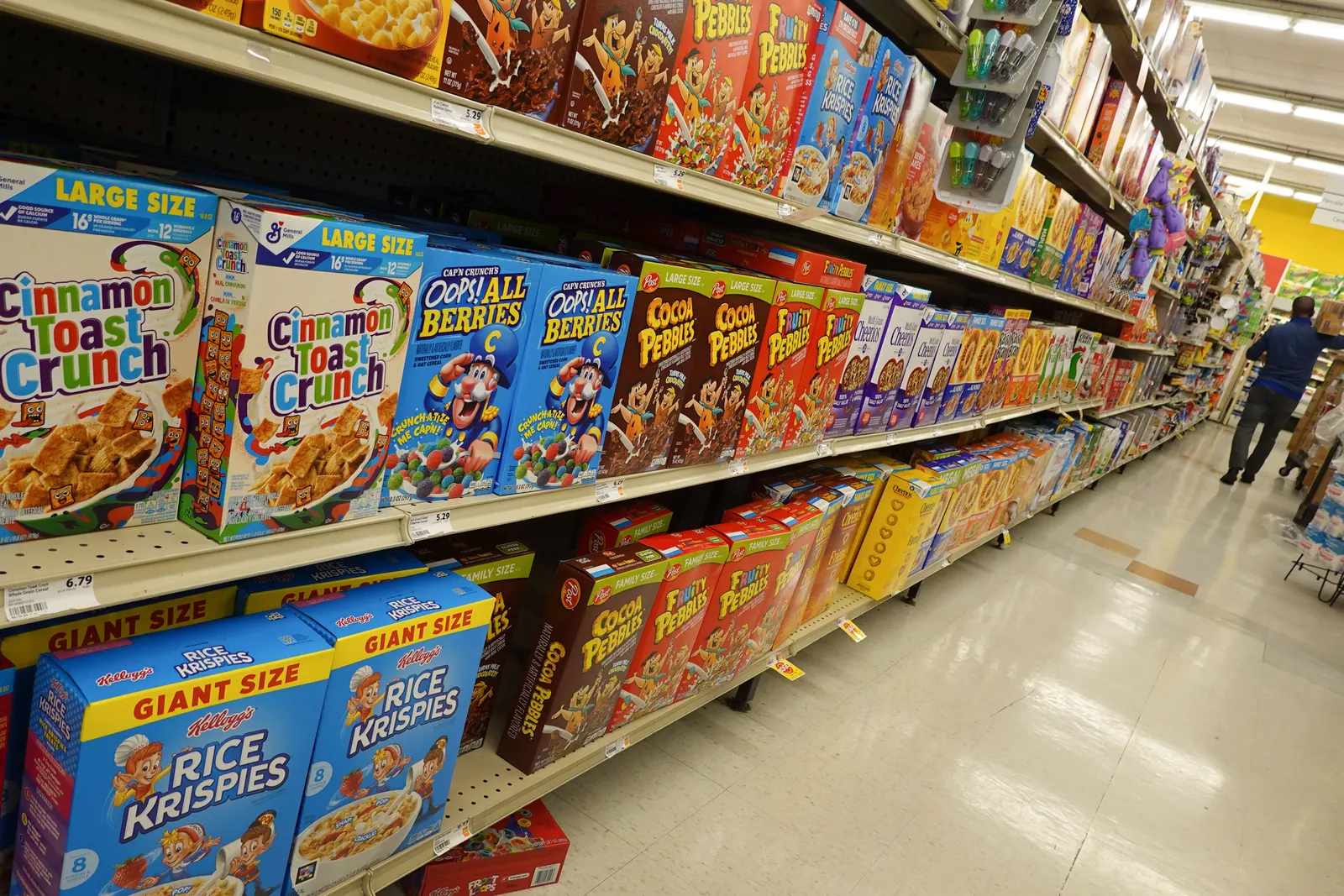Boxes of sugary cereal in a store.