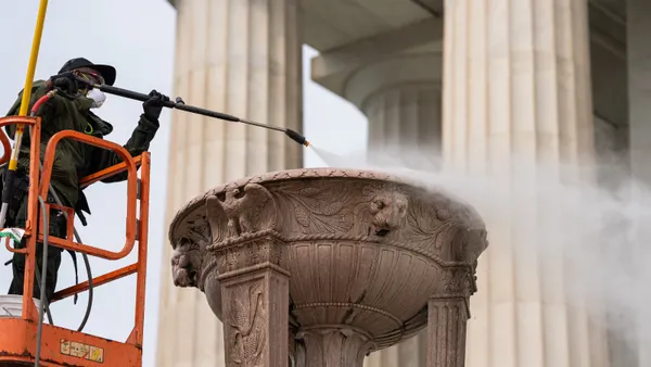 Crews clean the entrance to the Lincoln Memorial