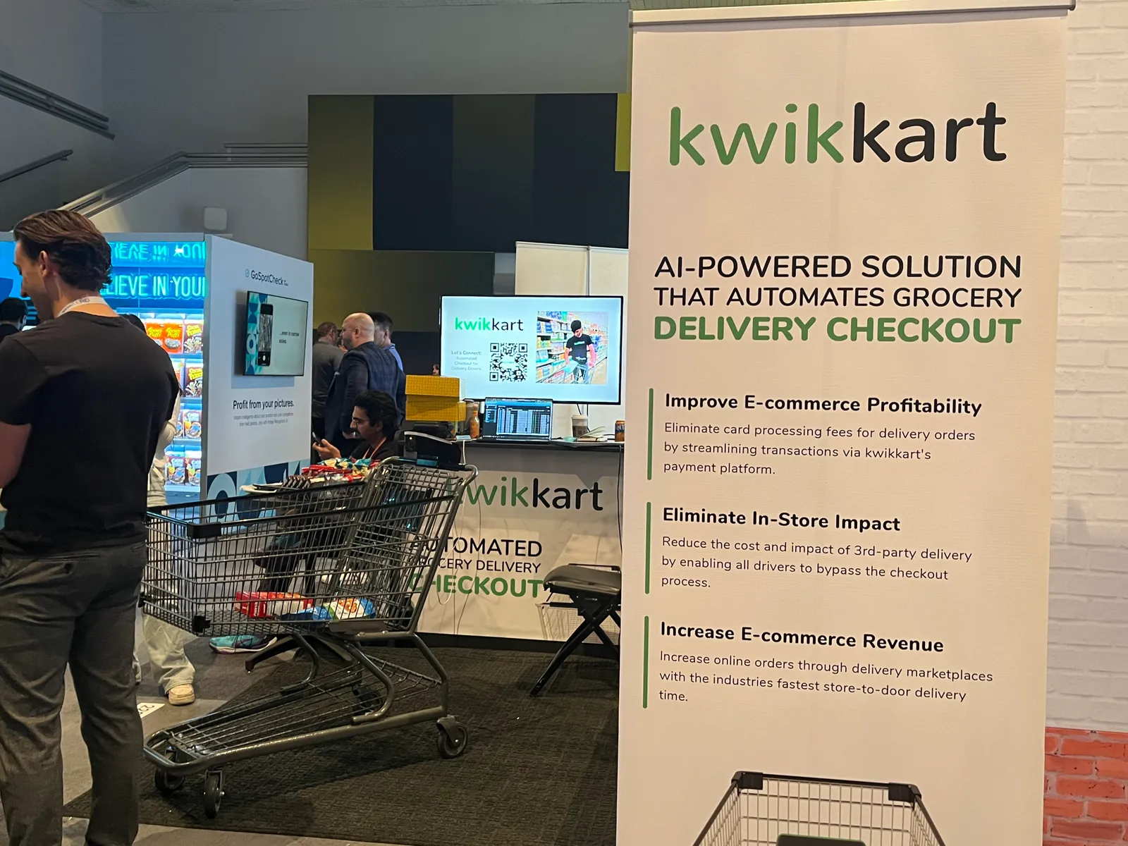 A booth with a shopping cart device.