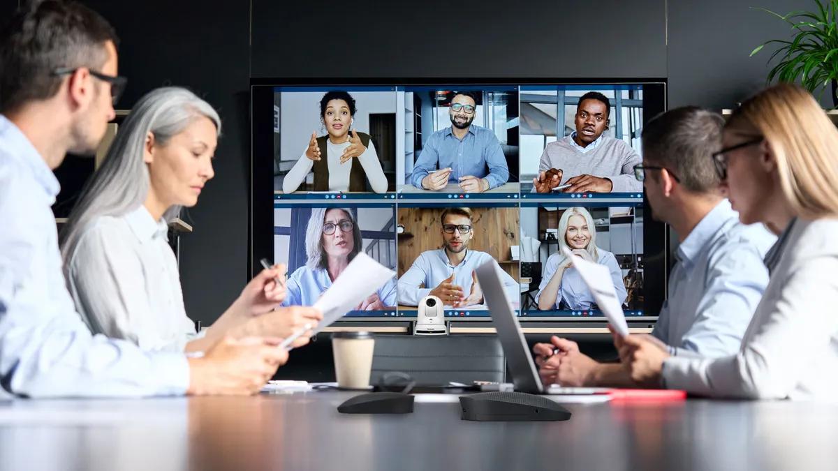 Virtual meeting in a meeting room.