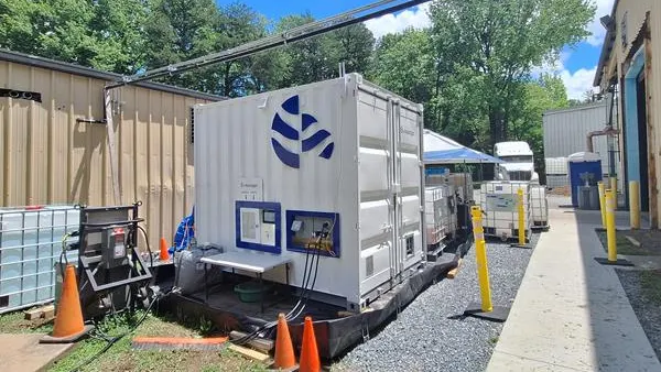 A small shipping container with technology used to treat PFAS-containing materials