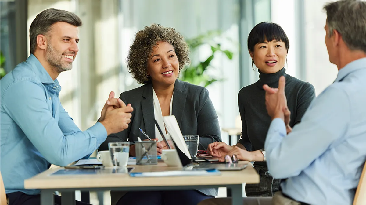 People smiling in a meeting