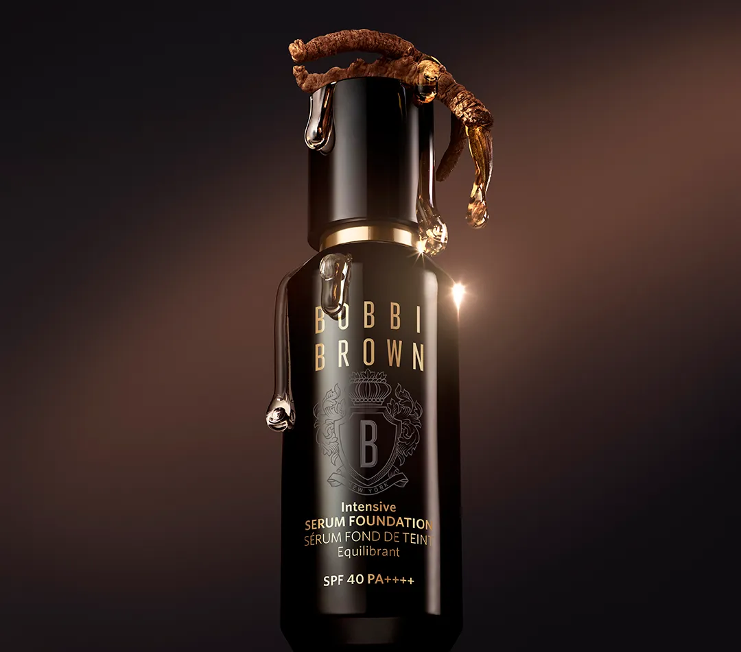 A black glass bottle of Bobbi Brown Intensive Serum Foundation.