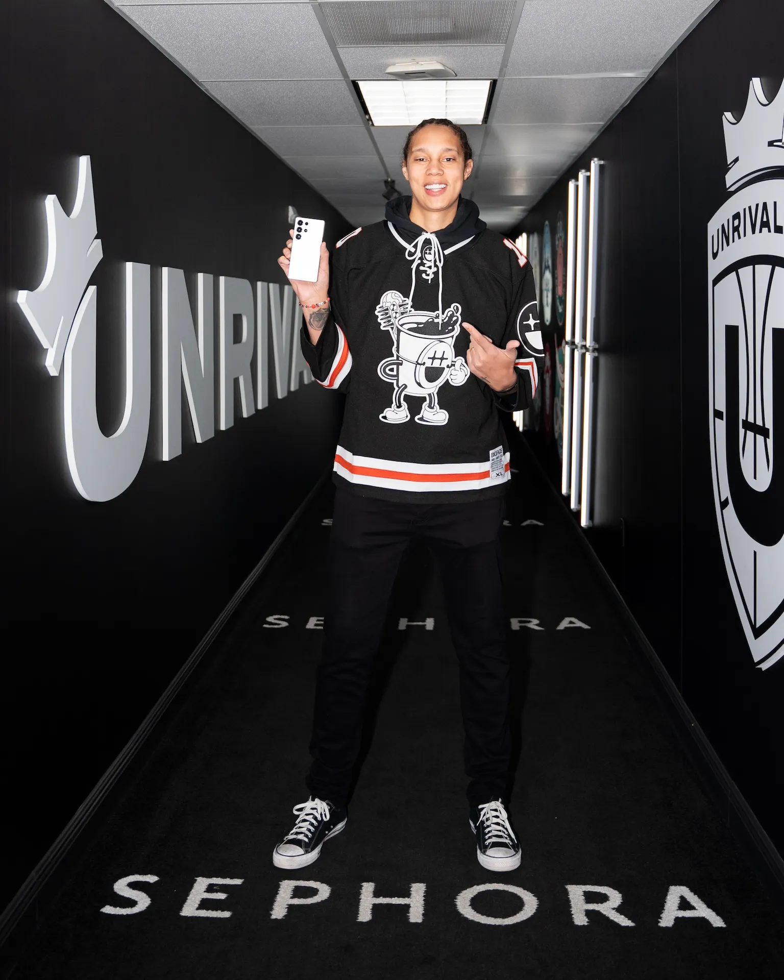 Brittney Griner holds a Samsung smartphone