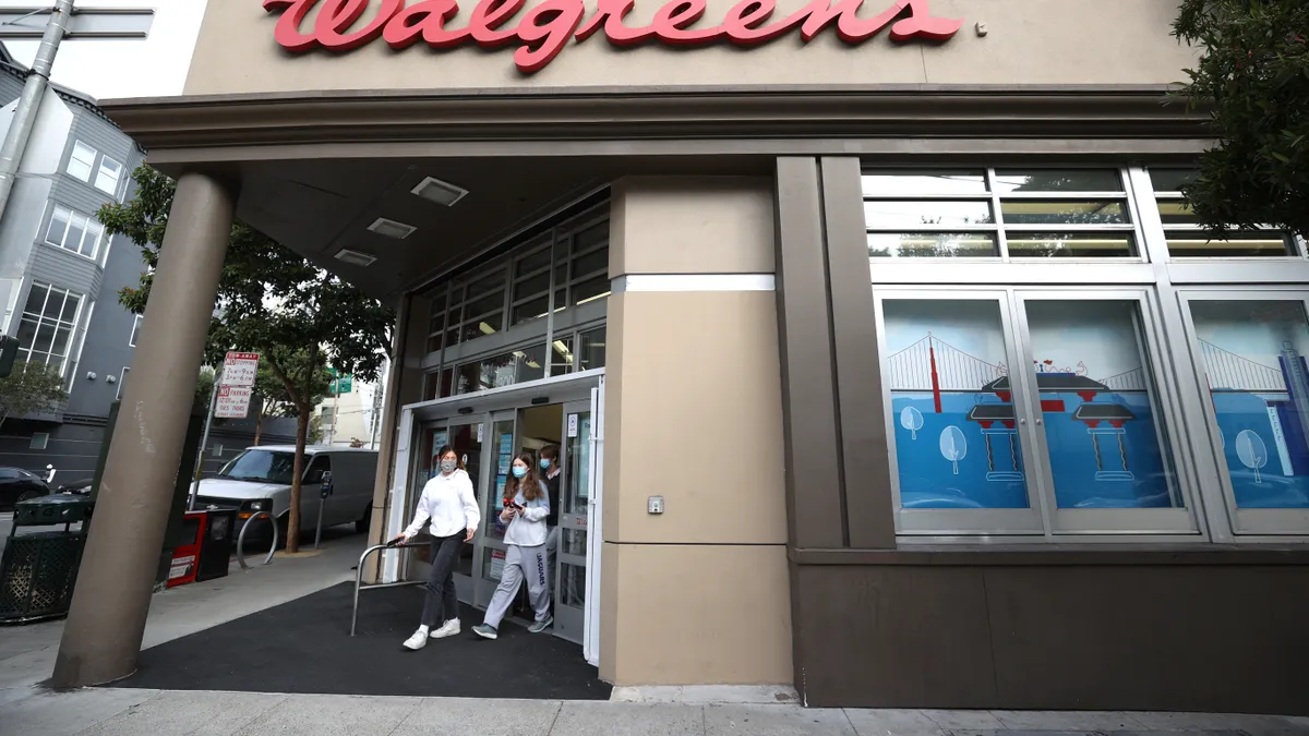 Customers leave a Walgreens store that is set to be closed in the coming weeks on October 13, 2021 in San Francisco, California