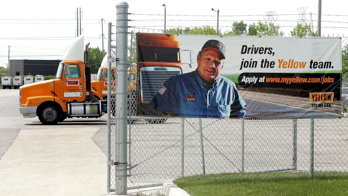 A large Yellow Corp. recruitment sign on the fence of a company truck terminal in Illinois in 2005 reads "Drivers, join the Yellow team. Apply at www.myyellow.com/jobs.""