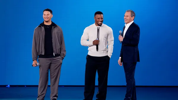 Patrick Mahomes and Saquon Barkley with Disney CEO Bob Iger