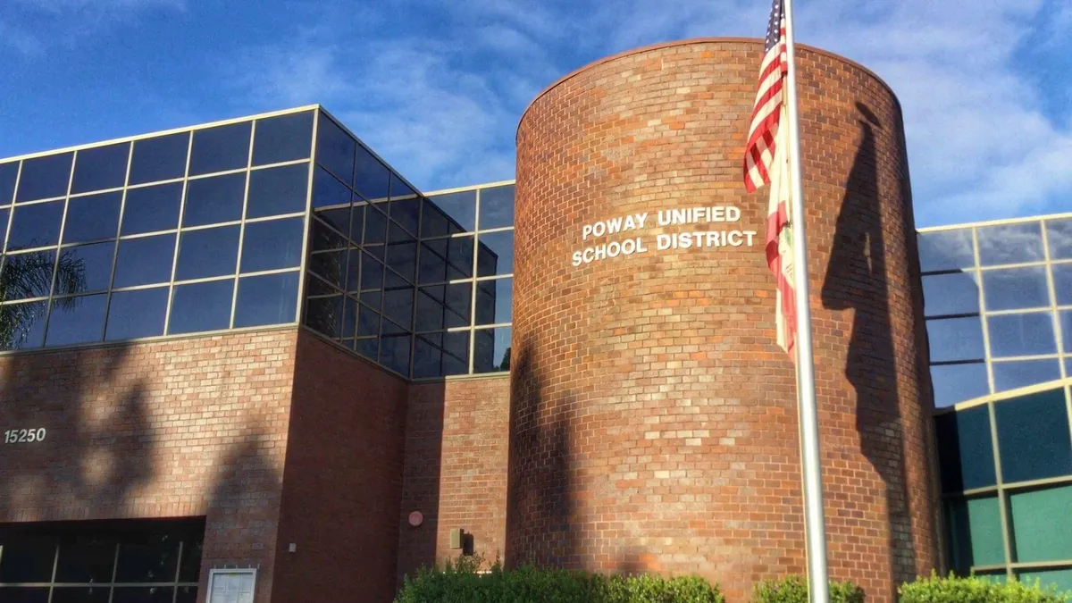 A brick building marked "Poway Unified School District"