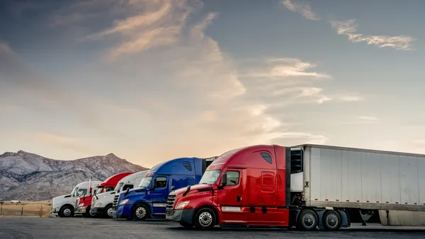Red White and Blue Parked Trucks Lined up at a Truck Stop in the wintertime in Utah