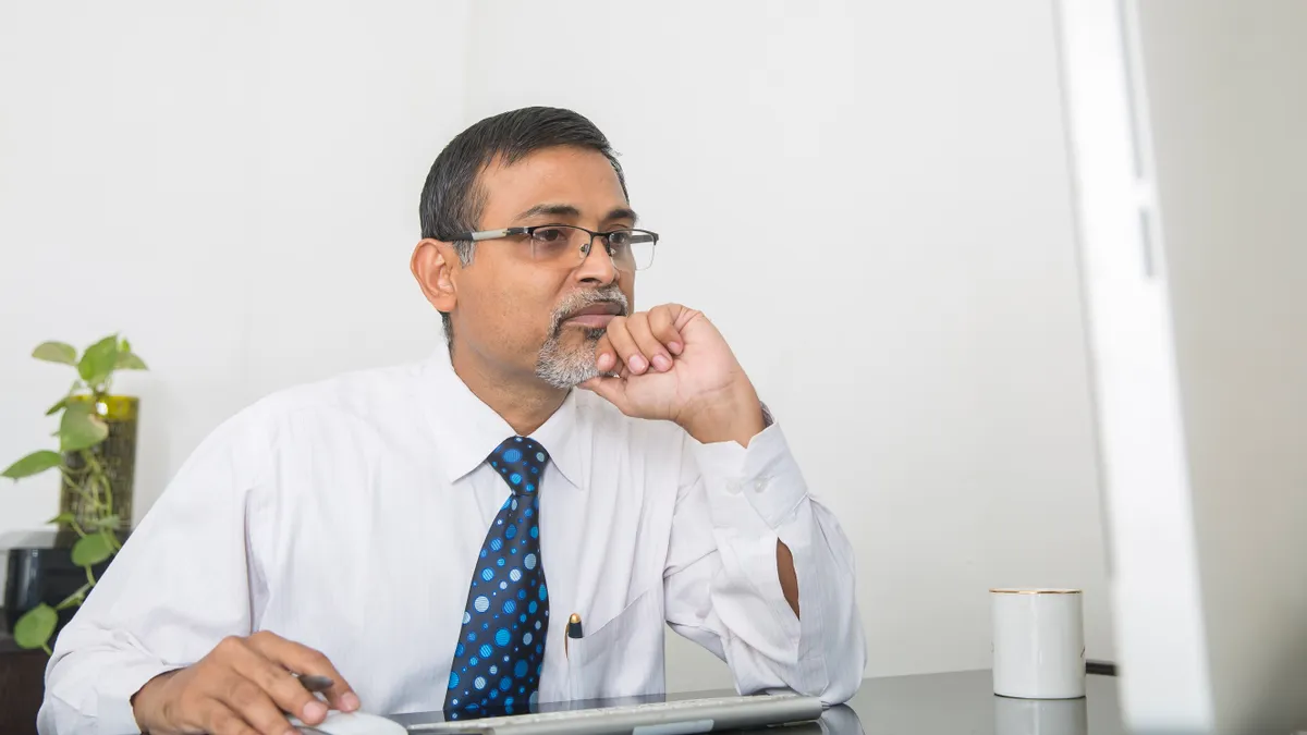 businessman working at his desk and thinking