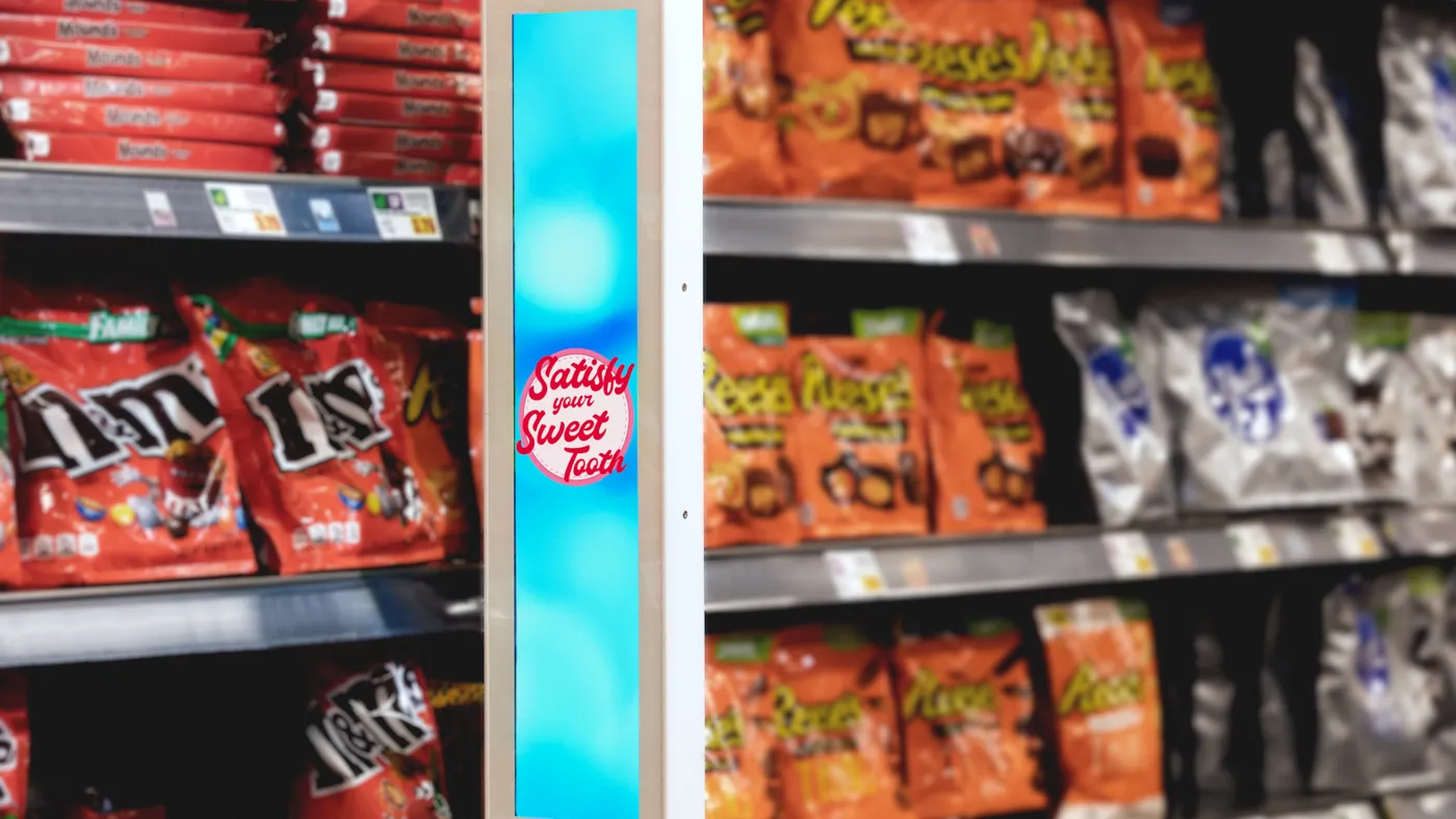 Aisle screen in candy aisle of grocery store