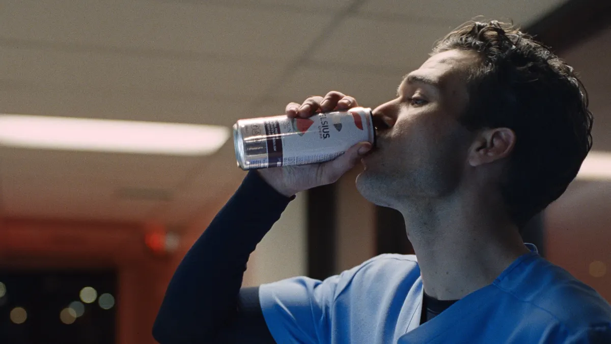 A nurse drinks Celsius at a hospital