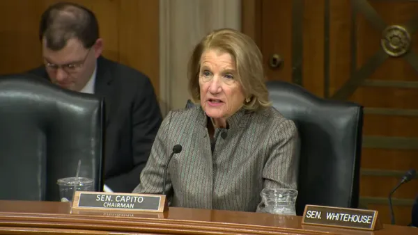 Sen. Shelley Moore Capito speaks from behind a desk