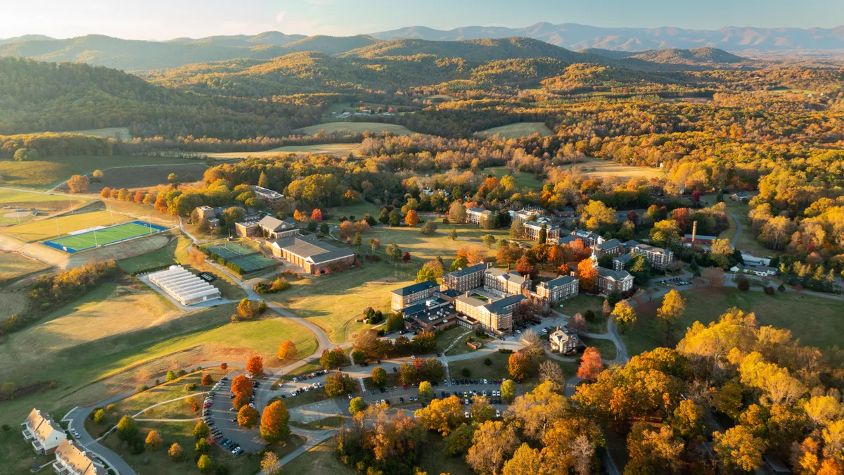 An aerial photo looks down on buildings and trees.