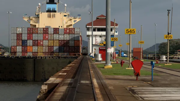 An ocean vessel transiting the Miraflores locks at the Panama Canal.