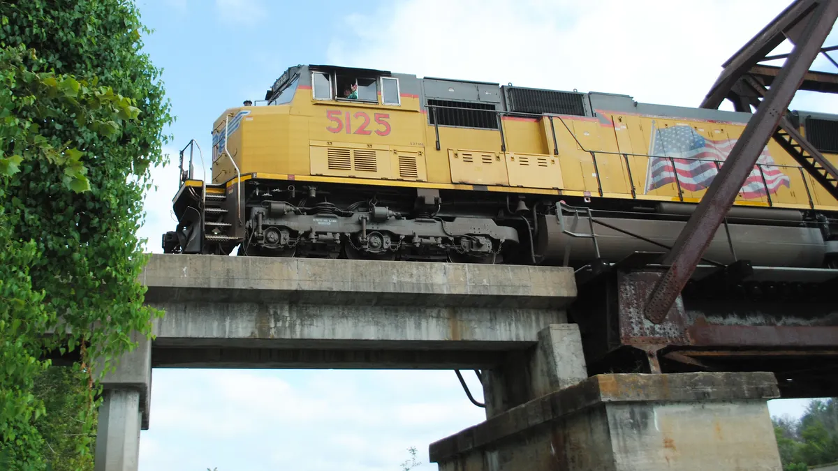 A Union Pacific train travels across a bridge in Riverside, Texas.