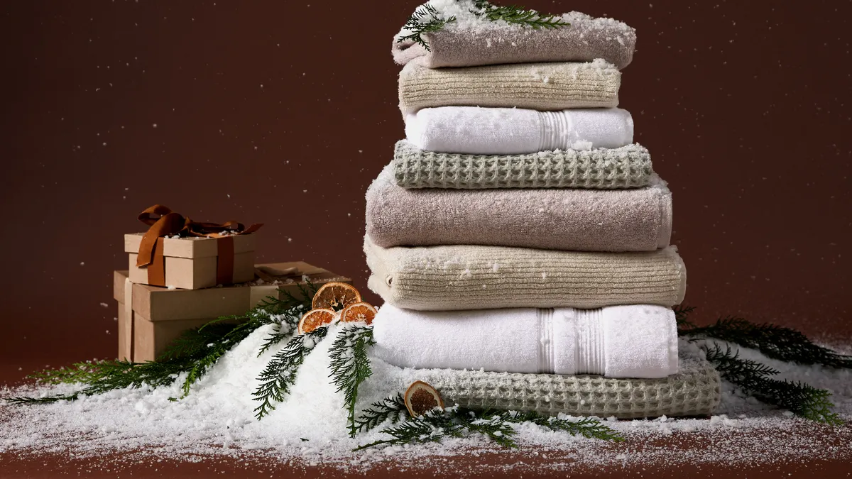 Towels stacked surrounded by artificial snow.