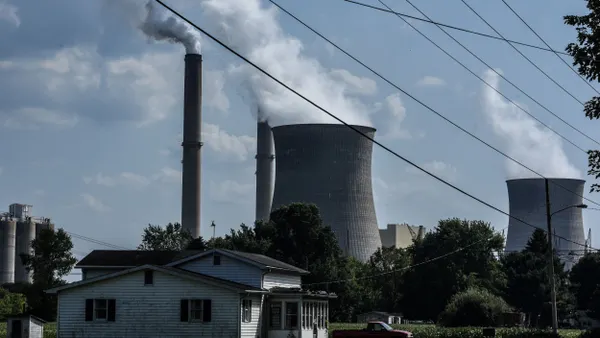 A coal-fired power plant with smokestacks.