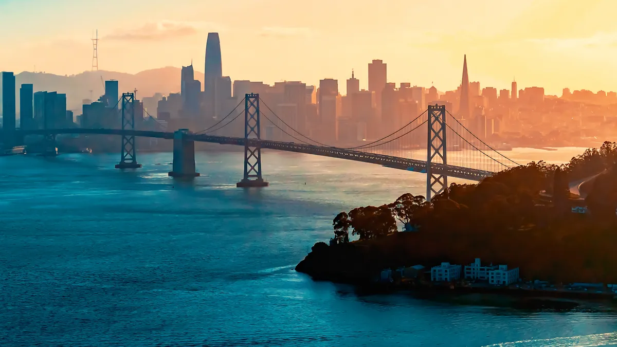 Aerial view of the Bay Bridge in San Francisco, California with skyline in background