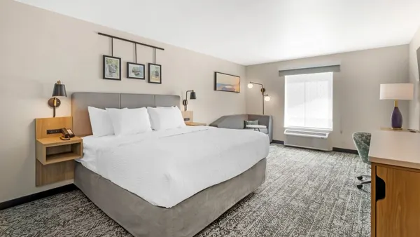 An image shows a room at a Sleep Inn hotel with the new Scenic Dreams prototype.