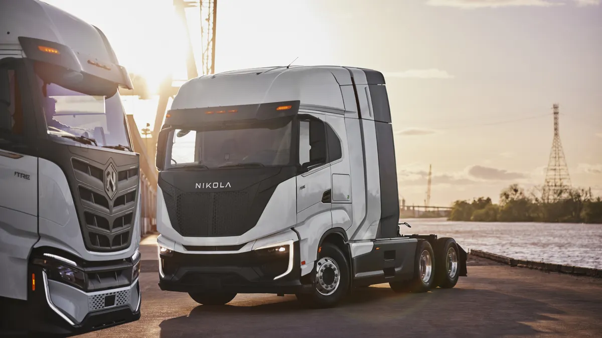 A Nikola hydrogen fuell cell electric vehicle (right) next to another truck.