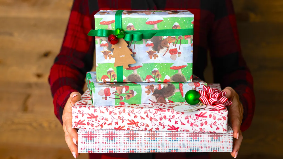 A person holding gift that used Wrappily's sustainability-minded wrapping paper