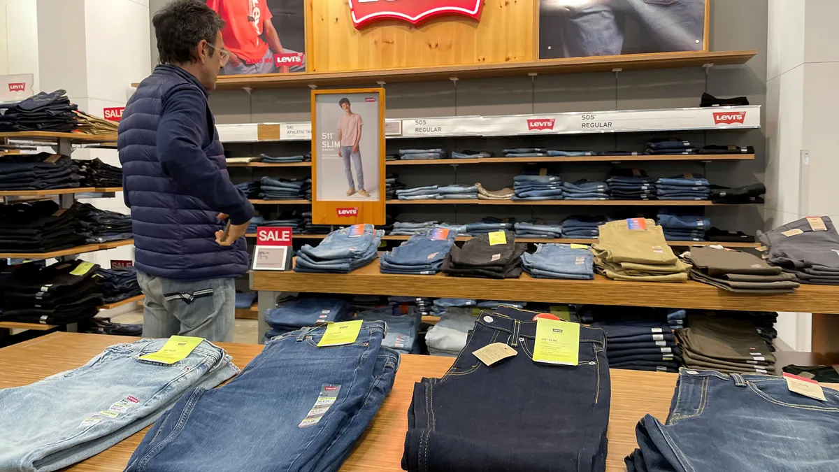 A customer shops for Levi's clothing at a department store on January 29, 2024, in Chicago, Illinois.