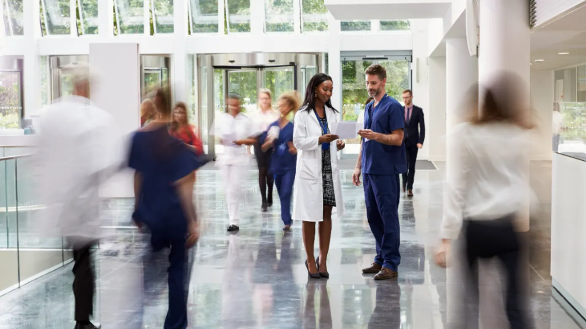 staff-in-busy-lobby-area-of-modern-hospital