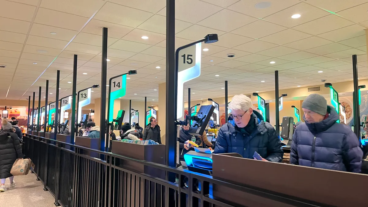 Dozens of self-checkout stations at a grocery store.