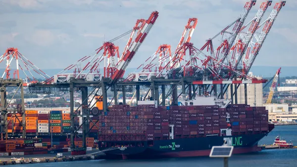 Shipping containers sit stacked in the Port of Newark.