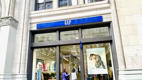 People going into a clothing store.