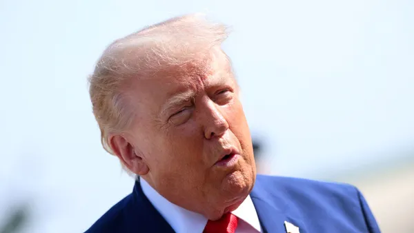 President Donald Trump speaks to reporters before boarding Air Force One on July 22, 2026, at Joint Base Andrews, Maryland.