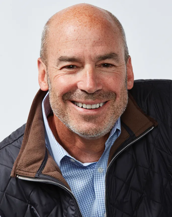 A headshot of Destination XL CEO Harvey Kanter smiling