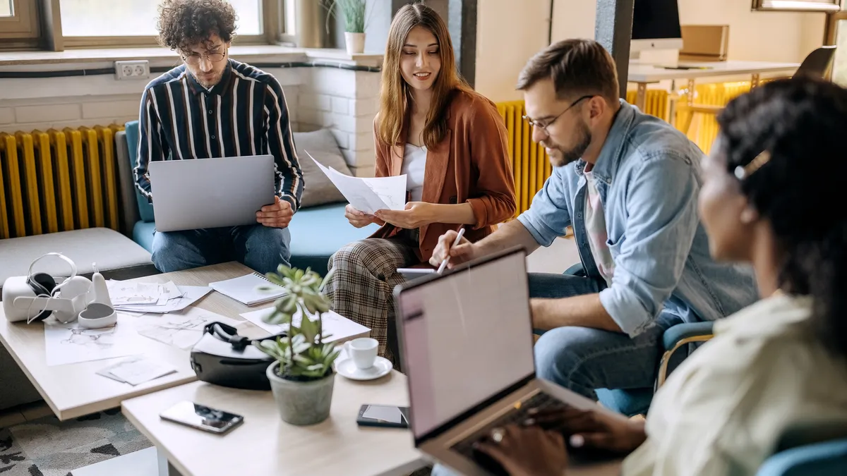 Group of Gen Z employees working in office