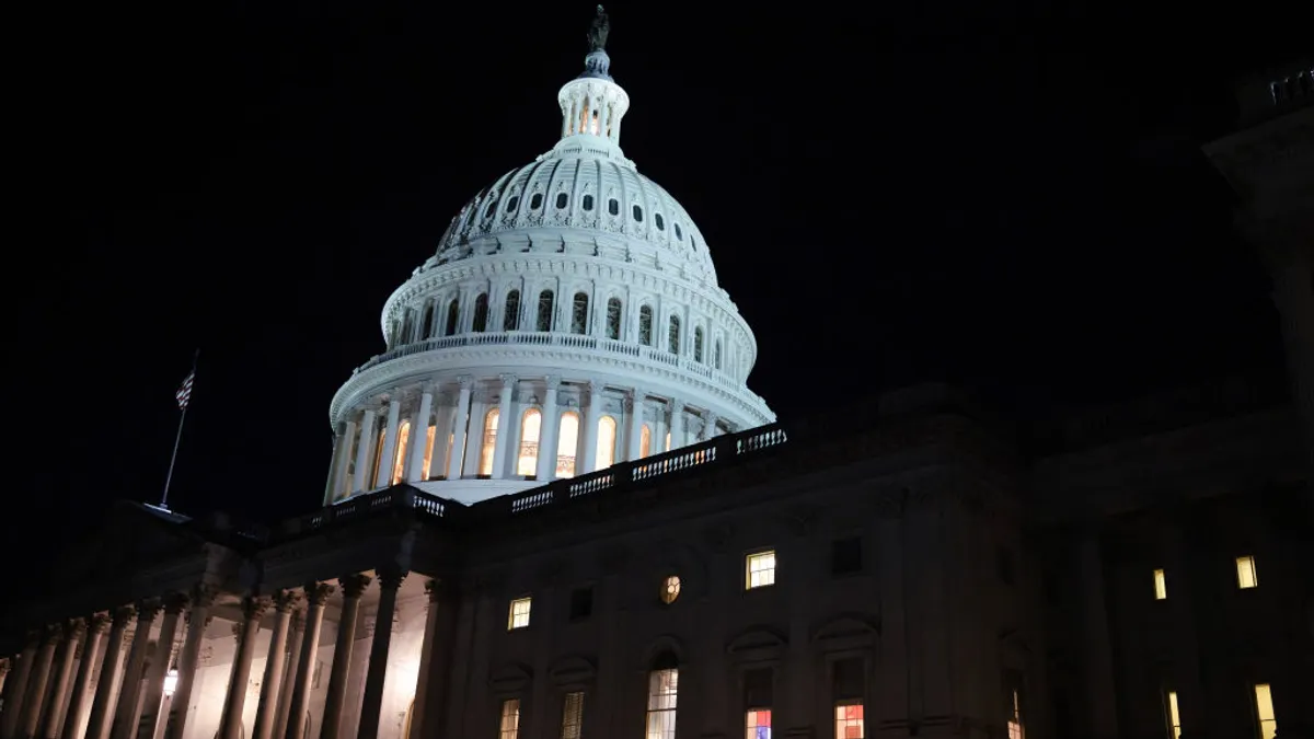 an exterior shot of the capitol building at night