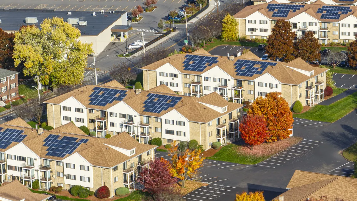 Rooftop solar panels at an apartment complex.