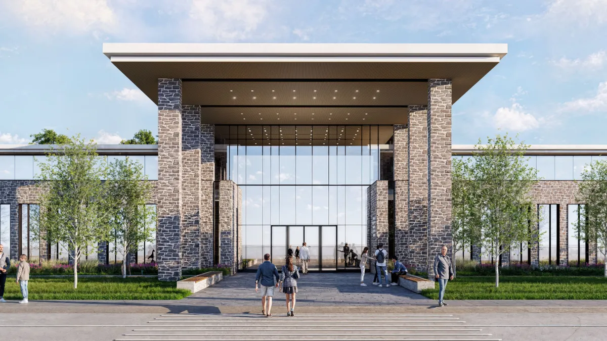 A rendering of the exterior of a building with glass facades and brick columns.