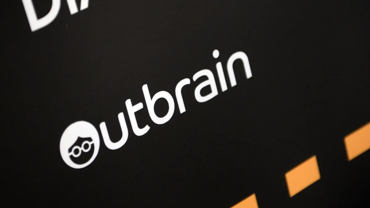 A white logo for Outbrain on a black background