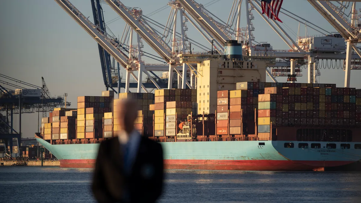 U.S. President Joe Biden waits to speak about the recently passed $1.2 trillion Infrastructure Investment and Jobs Act at the Port of Baltimore on November 10, 2021