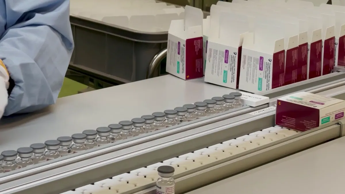 A screen shot from a video showing production of AstraZeneca's COVID-19 treatment Evusheld