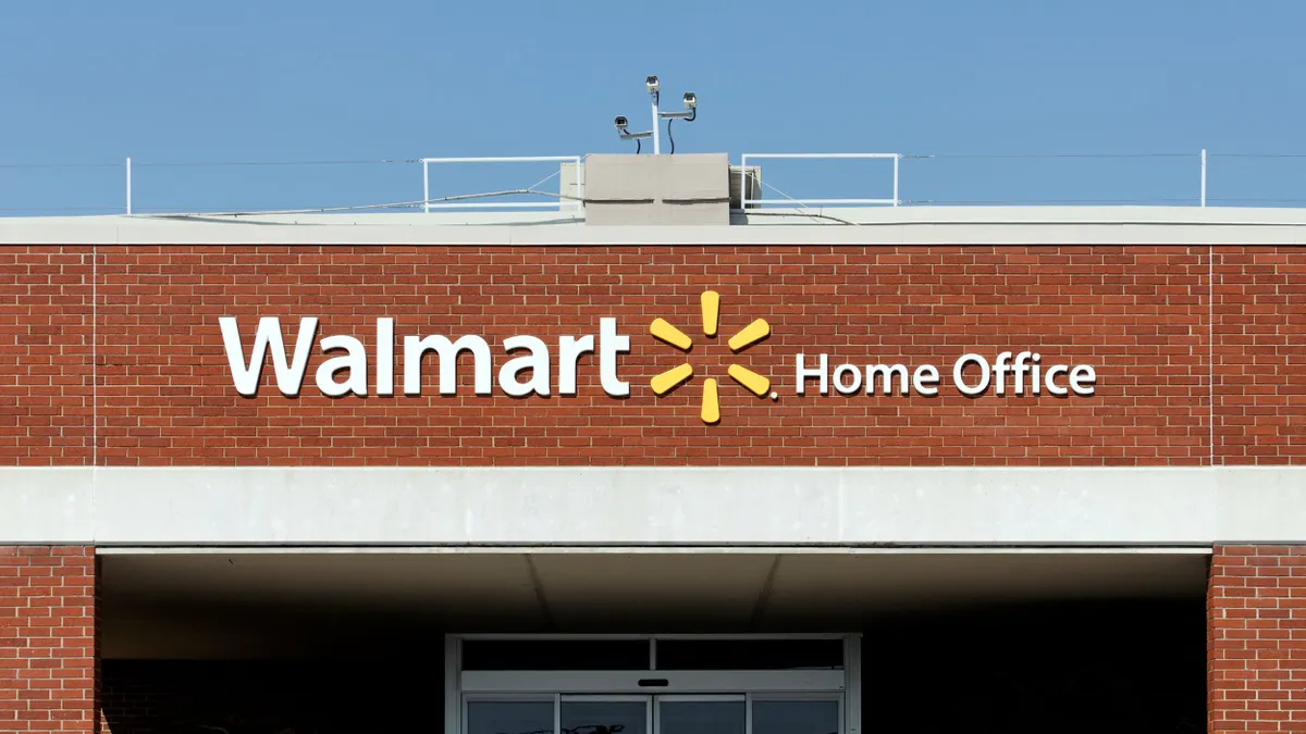 A sign on building reads "Walmart Home Office"
