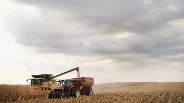 Farm equipment is seen on a corn field