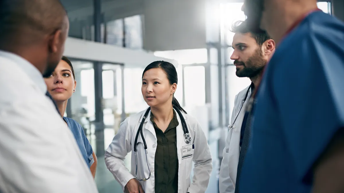 Photo of a team of doctors having a discussion.