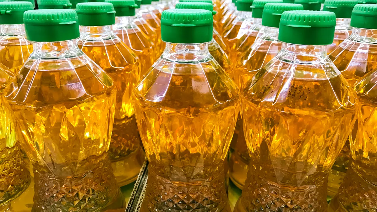 Closed up pile of bottled palm oil in the market