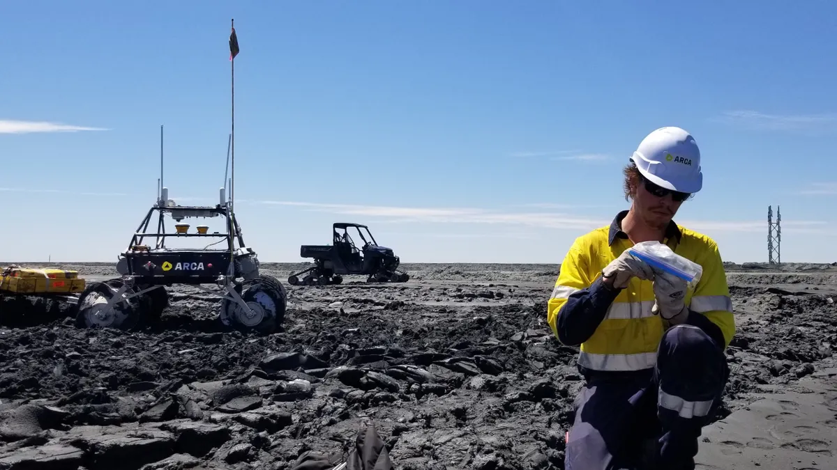 Arca scientist reviewing mine waste samples