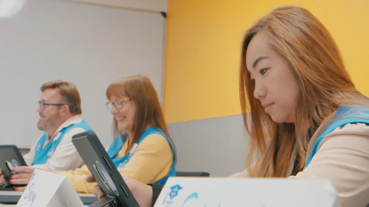 Picture of Walmart associates taking part in a learning program.